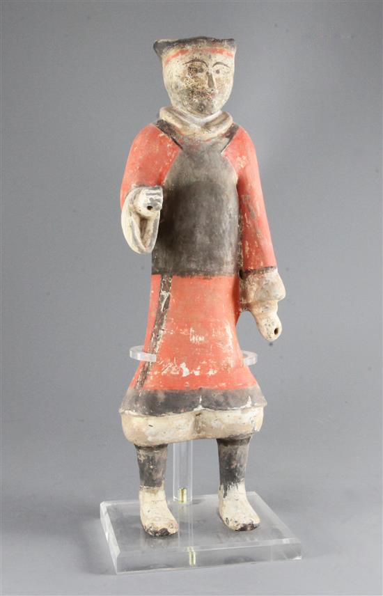 A large Chinese polychrome pottery figure of a standing soldier, Han dynasty (206BC - 220AD), 44.5cm, modern stand